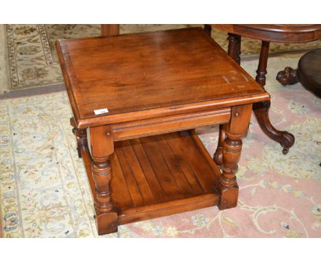 A good quality reproduction coffee table of square form raised on turned legs with base shelf, 60cm wide