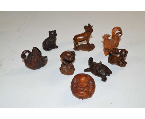 Plastic bag containing a quantity of wooden Netsuke of various animals, tortoise, monkeys etc