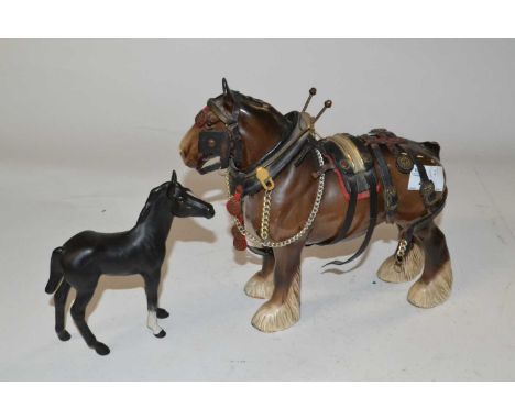 A Beswick model of a horse with saddle together with a Beswick Black Beauty foal in matt finish