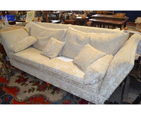 A large modern Knowle style sofa with drop ends and floral loose cushions, 250cm wide