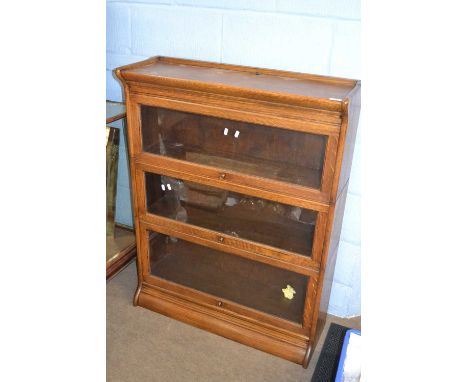 A Globe Wernicke oak three tier stacking bookcase, 87cm wide