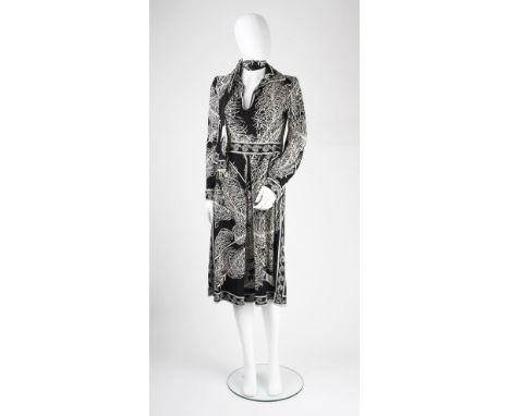 An Emilio Pucci black and cream dress, with collar, deep v-shaped neckline and tie, label to neck 