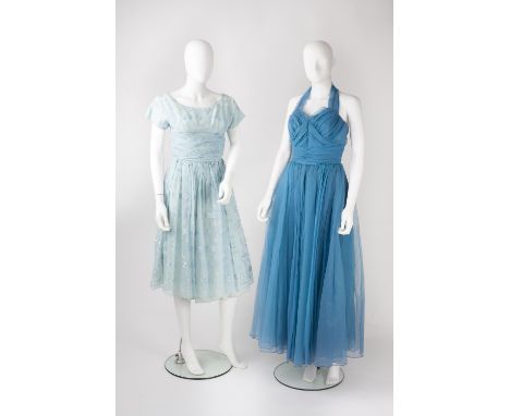 Four evening dresses, comprising a 1950s blue crepe dress, ruched bodice with bow detail, thin straps and zip fastening to si