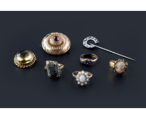 A collection of jewellery, comprising three vari gem-set cluster rings, a shell cameo ring (adapted), a pair of gem set earst