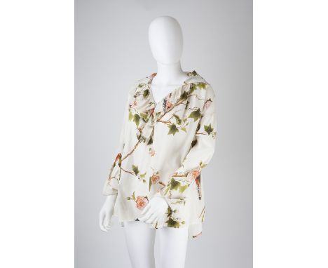 An Alexander McQueen cotton cream blouse, decorated with birds of paradise, flowerheads and foliage, large collar and ruffle 