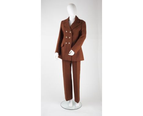 A brown Harris Tweed Marion Foale & Sally Tuffin trouser suit, the double-breasted jacket with long sleeves, collar and butto