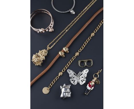 A collection of costume jewellery by Alexander McQueen, comprising a skull and curb-link bracelet, a butterfly pendant, a dou