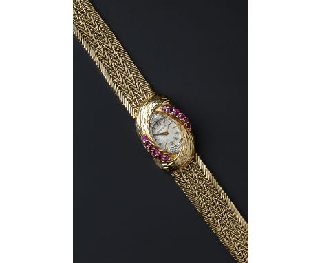 A lady's 18ct gold and gem set wristwatch by Jaeger-LeCoultre for Kutchinsky, the oval signed silvered dial with Arabic numer
