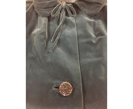 A 1960s blue velvet coat, single button fastening to front, collar with bow decoration, together with a navy blue velvet bag 