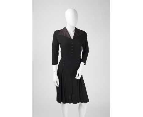 A black crepe dress, with bracelet length sleeves, silk collar, button detail to waist and flared skirt, together with two pa