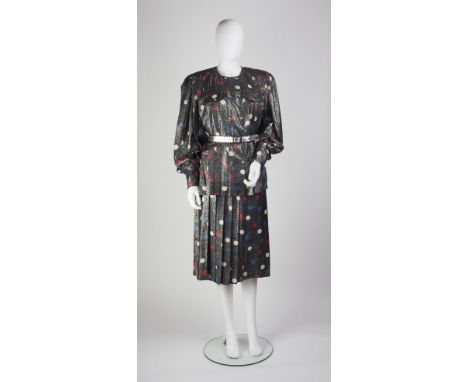 A grey Bruce Oldfield skirt and blouse set with metallic thread running through, with red and blue polka dot pattern, the blo