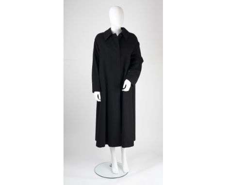 A Burberry black wool and cashmere coat, with collar, buttons and pockets to front, full length sleeves with button detail, p
