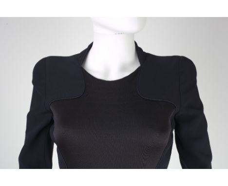 An Alexander McQueen navy coat dress, inset curved panel, slits to sides and back, full length sleeves with button detail, zi