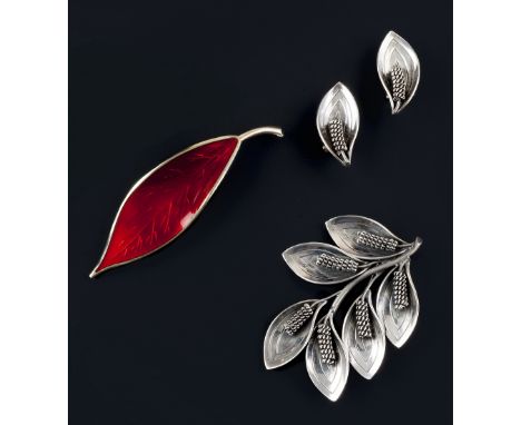 A Danish brooch and earclips suite by Aarre and Krogh, of stylized foliate design, stamped 'A&K Sterling', brooch length 5.7c