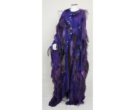 A 1960s theatrical costume worn by actress Elisabeth Bergner and designed by Yolande Sonnabend, consisting of a purple george