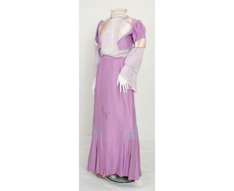A 1970s Edwardian style theatrical costume consisting of a lilac full outfit and hat, the long silk skirt with blue/grey lace