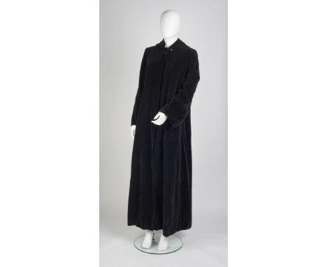 A long black velvet hooded coat, red satin lining, long fluted sleeves, single button fastening to front, Anthony Charles for