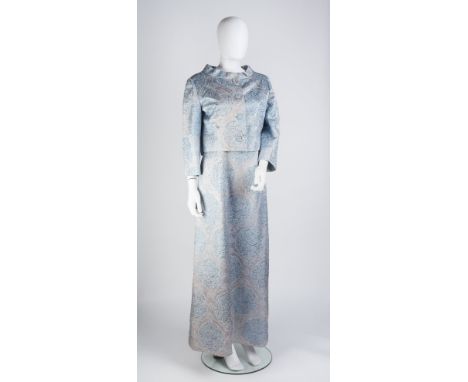 A 1960s Norman Hartnell couture full length dress and jacket in pale blue silk brocade, the jacket with round neck, bracelet 