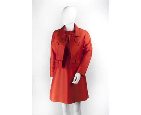 A Louis Féraud red jacket and skirt suit, the dress with round neck, short sleeves, square button detail to front of bodice a