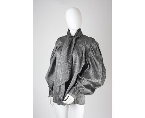 An Alexander McQueen grey silk blouse, with attached neck tie, full length cuffed sleeves, buttons to front, Alexander McQuee