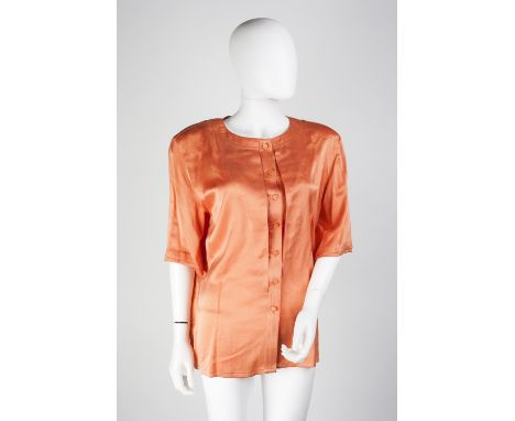 A Louis Féraud peach silk blouse with round neck, elbow length sleeves and silk buttons to front, together with a maroon Loui