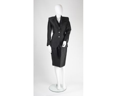 An Alexander McQueen black skirt suit, collared jacket with sheer panel to back and embroidered ivy leaves, button detail to 