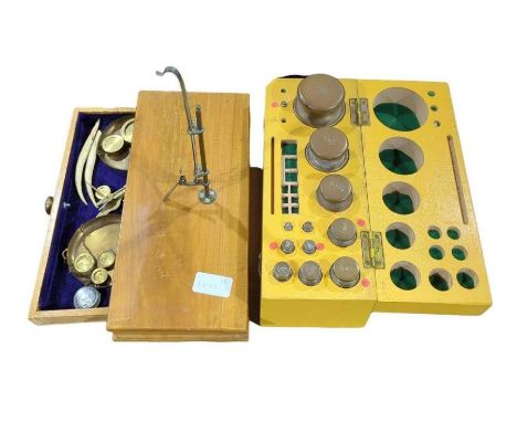 A set of 20th century apothecary's balance scales and weights the larger weights contained in a fitted box