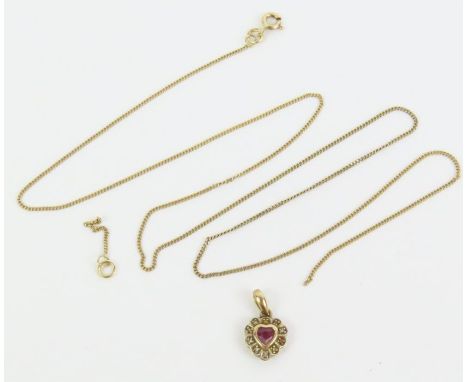A 9ct gold ruby and diamond heart shaped pendant and a 9ct gold filed link chain, 2.6g gross
