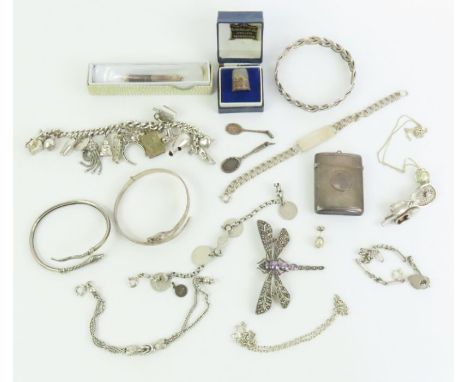 A heavy silver charm bracelet with various charms attached, a silver snake bangle, a silver vesta case, and various other ite