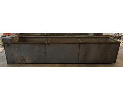 A very large galvanised and rivetted water trough 303cm x 64cm x 67cm deep