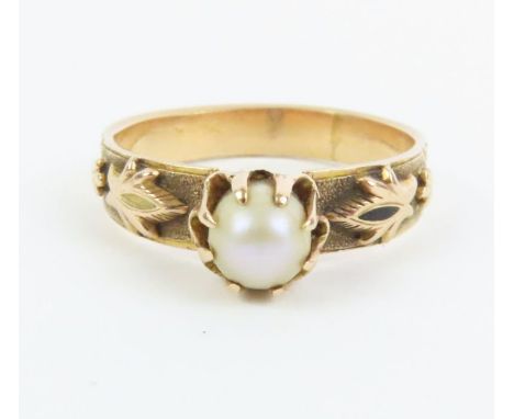 A single stone pearl dress ring, with decorative shoulders, finger size K, 2.3g gross, tests as 18-22ct gold (the pearl untes