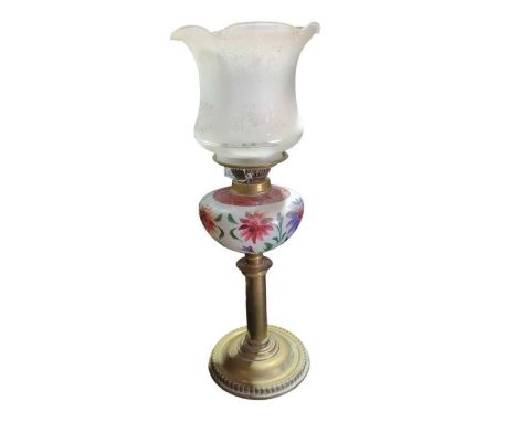 A late Victorian oil lamp having floral painted white glass reservoir, brass pillar and base and with etched shade, height to