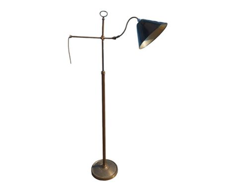 A 20th century brass patinated adjustable floor lamp with shaped carrying loop and adjustable S shaped arm, 149cm high