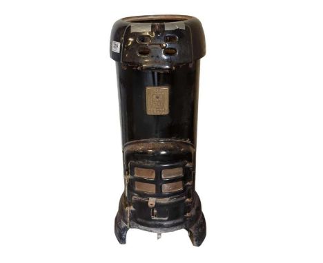 A black enamel stove 75cm high