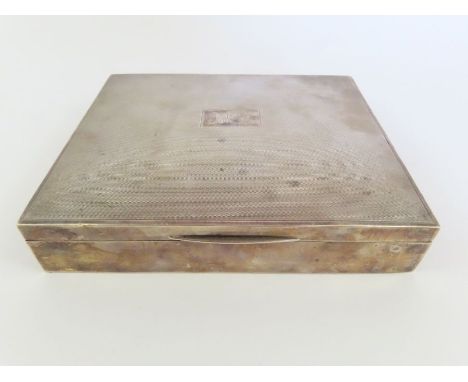 A silver cigarette box, wood lined, the lid with engine turned decoration to the lid, Birmingham, 1947, Harman Brothers, 17cm