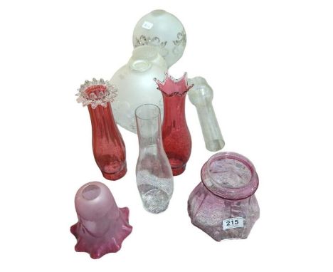 Two decorative cranberry glass oil lamp chimneys together with various other glass oil lamp shades and plain chimneys