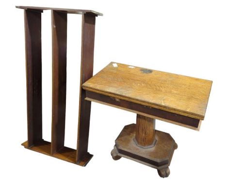 A Victorian oak rectangular swivel top fold-over tea table on octagonal pillar and rectangular base with shaped supports, 75c