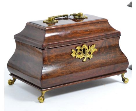 A George II Mahogany Tea Caddy, of ogee rectangular form, the hinged cover with swing handle enclosing three lidded compartme