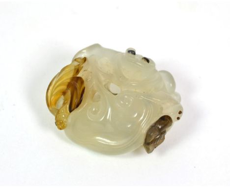 A Chinese Jade Carving, late 19th/20th century, worked with monkeys amongst fruiting branches, 4.5cm