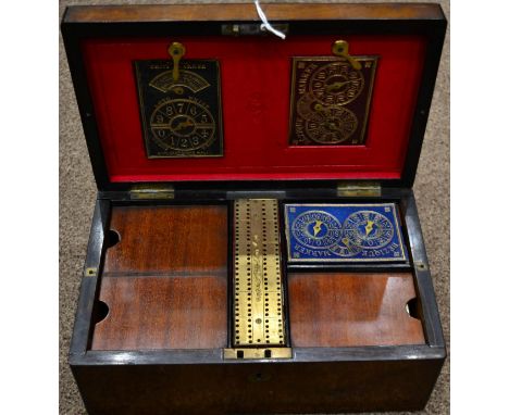 A Victorian Walnut Travelling Games Compendium Box, of rectangular form with hinged sides and fitted interior and crib board,