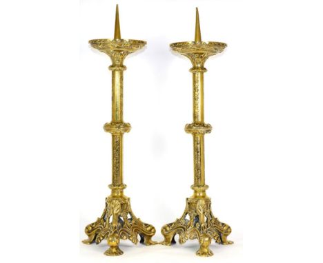 A Pair of Brass Pricket Candlesticks, mid 19th century, with foliate cast circular drip pan, knopped cylindrical stem and tri