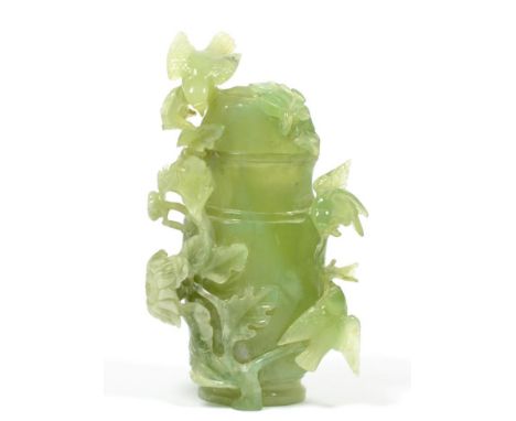 A Chinese Jade Vase and Cover, late Qing Dynasty, of baluster form, with birds amongst flowering branches, 20cm high