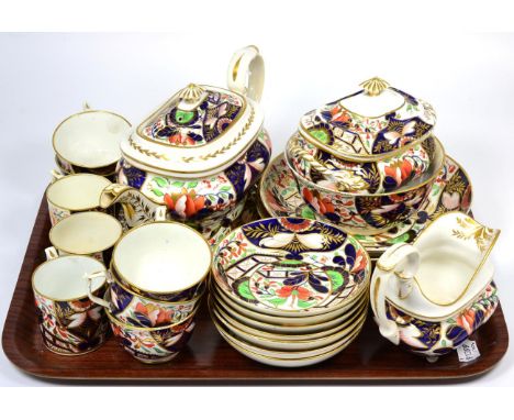 A Derby Porcelain Tea Service, circa 1830, painted with an Imari pattern, comprising a teapot, cover and stand, sucrier and c