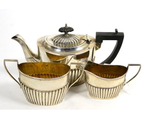 An Edwardian Silver Three Piece Bachelor's Tea Service, William Aitkin, Birmingham 1902, of oval part fluted form, the teapot