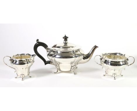 An Edwardian Silver Three Piece Tea Service, Charles Edwards, London 1909, of inverted baluster form, the teapot 25cm long ha