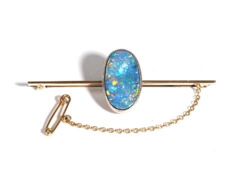 A Boulder Opal Bar Brooch, an oval cabochon boulder opal in a milgrain setting, to a knife edge bar, measures 2cm by 5.5cm Th