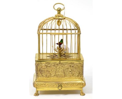 A Singing Bird in a Cage Automaton, 20th century, domed gilt metal bird cage, single bird with multi coloured feathers, embos
