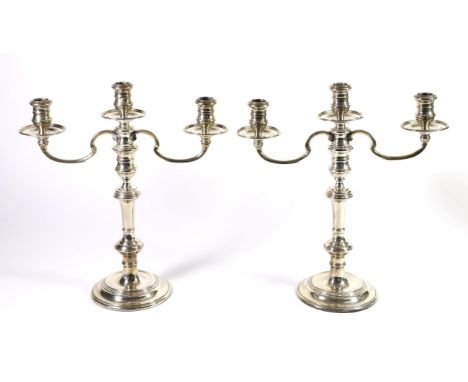 A Pair of Silver Three Light Candelabra, William Comyns & Sons, London 1961, of 18th Century style, the knopped stem on circu