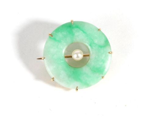 A Jade and Pearl Brooch, a jade bi in a claw setting with a central pearl, measures 2.5cm in diameter The brooch is in good c