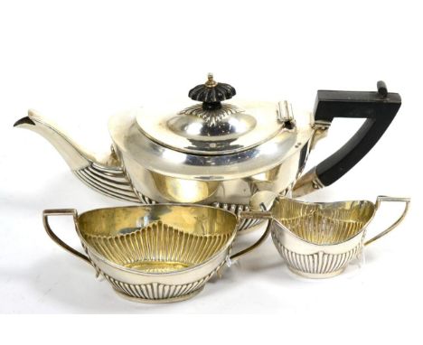 An Edwardian Silver Three Piece Bachelor's Tea Service, William Devenport, Birmingham 1903, of oval part fluted form, the tea